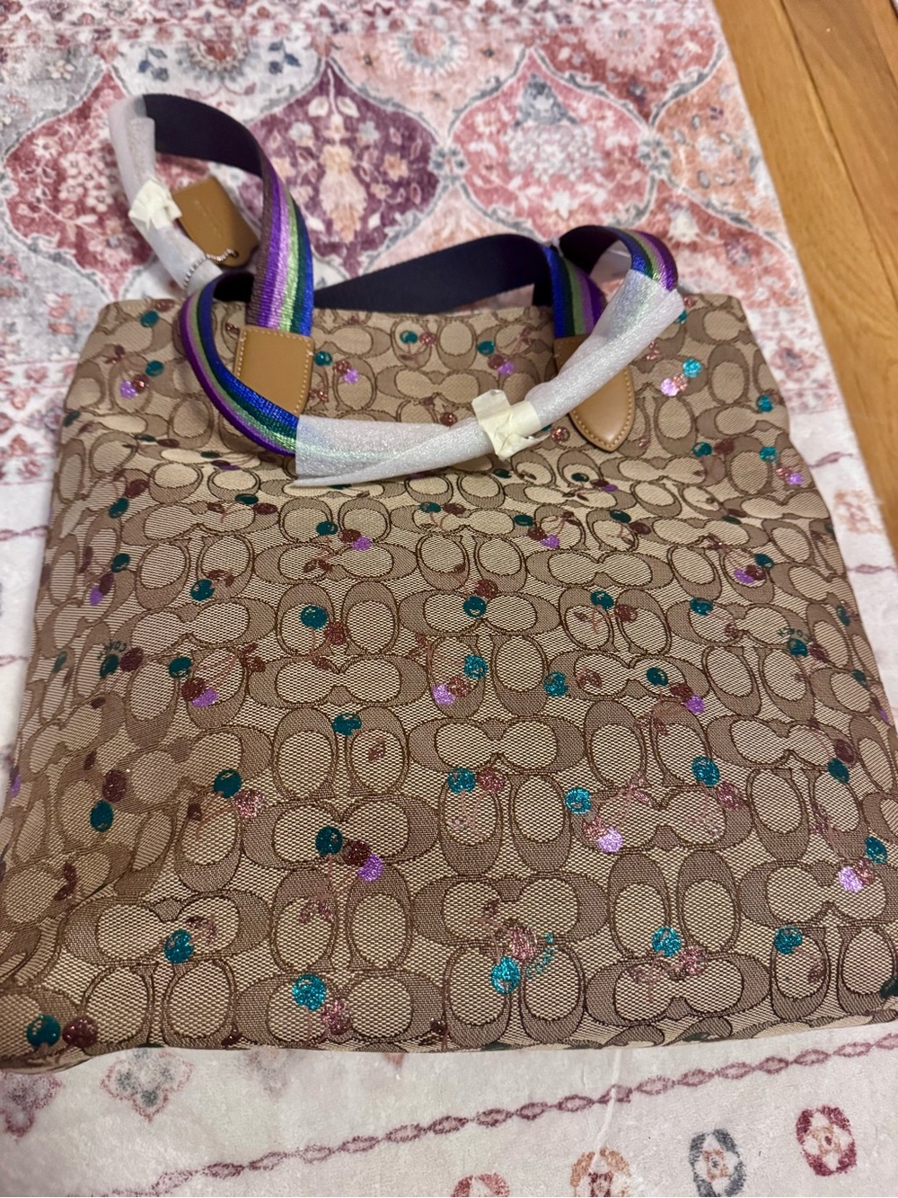 Coach Beige Signature Canvas Tote with glitter cherries and rainbow handles
